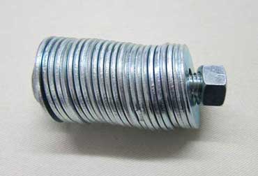 Washers for pattern weights, stored on a big bolt.